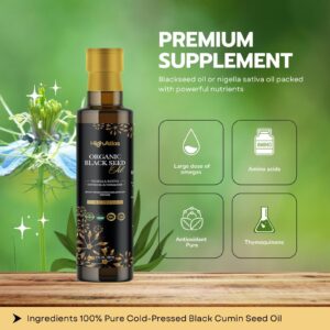 Bottle of organic black seed oil with plant background