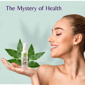 Neem-based insect repellent spray held by a smiling woman with green leaves