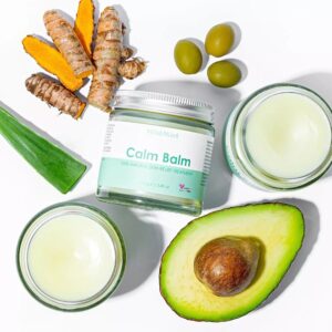 WildMint Calm Balm jar surrounded by natural ingredients.