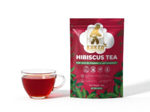 Package of Hibiscus Tea with a cup of brewed tea.
